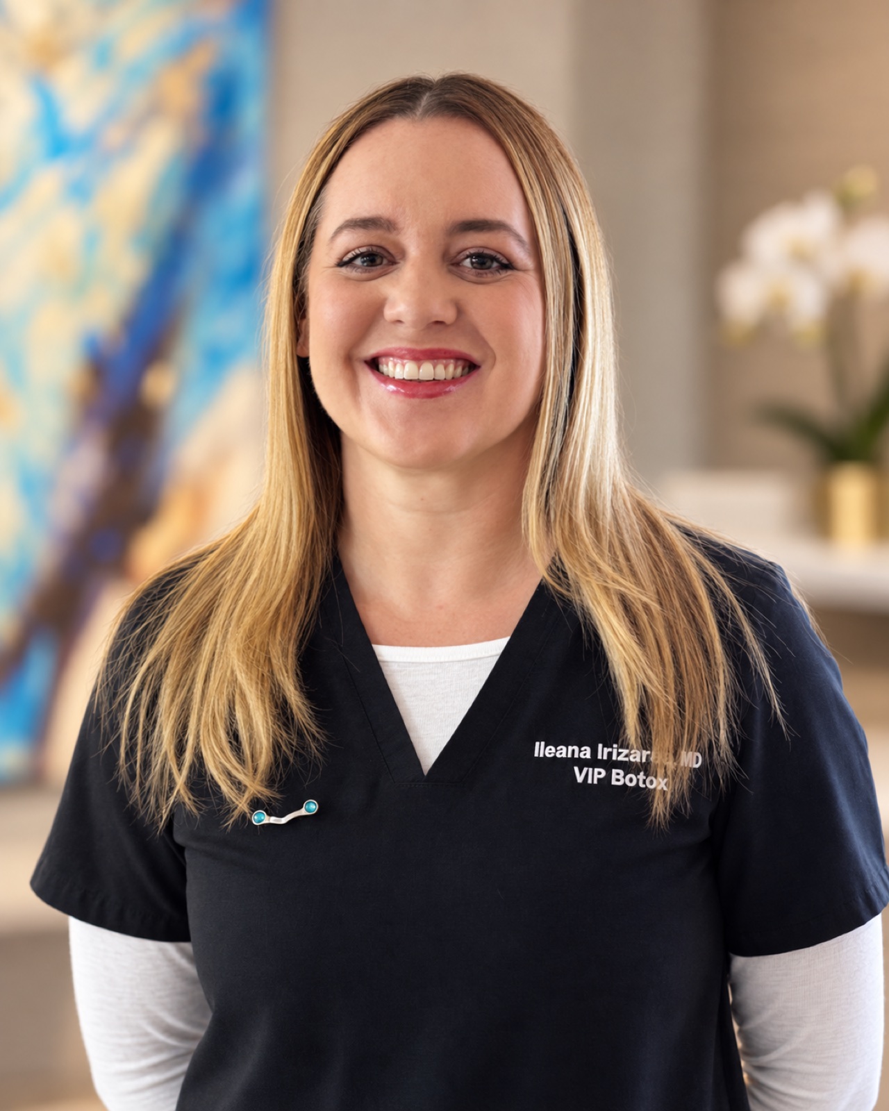 Dr. Ileana in dark medical scrubs